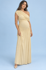 Beige zwangerschapsmaxijurk met asymmetrische halslijn en verlaagde taille