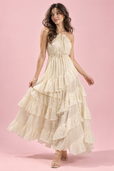 Beige maxi-jurk met halterhals, open rug en ruches