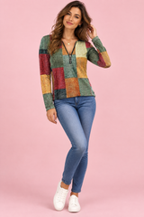 Groene top met patchworkprint en rits