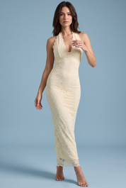 Robe longue en dentelle jaune à encolure asymétrique et détail au col | Vue de face | Lounelle Paris