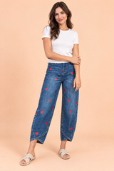 Blauwe broek met bloemenprint en splitzoom