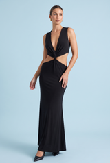 Zwarte maxi-jurk met asymmetrische halslijn, taille-uitsparingen en gouden details
