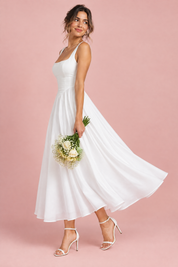 Robe midi blanche à fines bretelles et ourlet ample | Vue de dos | Lounelle Paris