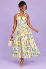 Gele halterjurk met bloemen en strepen