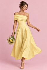Gele asymmetrische off-shoulderjurk