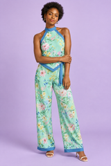 Mintgroene playsuit met bloemenprint, halternek en asymmetrische snit